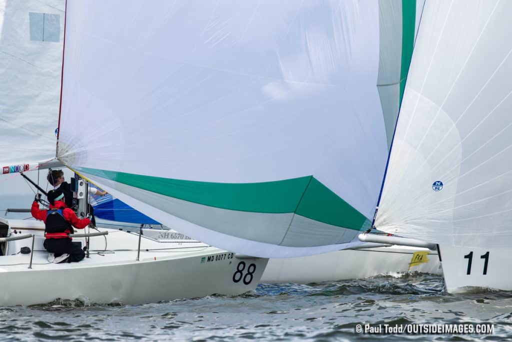 green and white sailboat