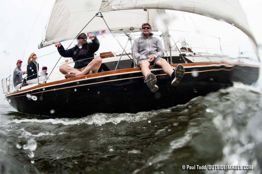 two men on a sailboat shot with a fisheye lens