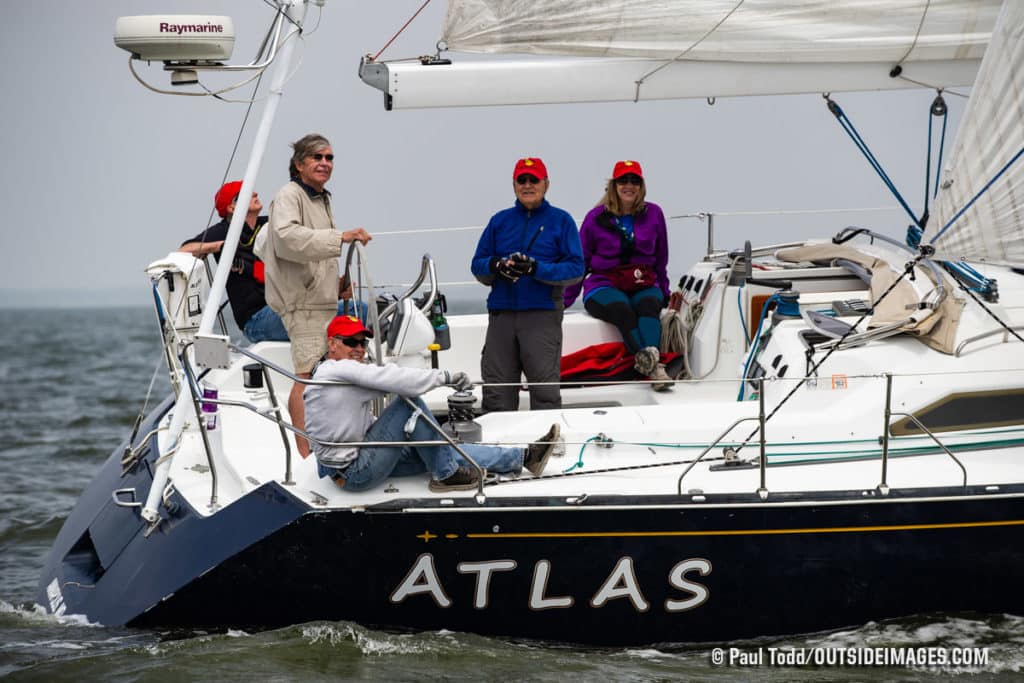 People aboard a sailboat named Atlas