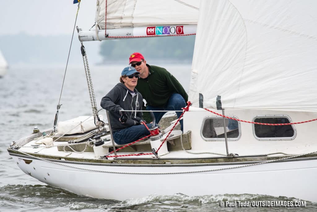 Couple in sunglasses on a sailboat