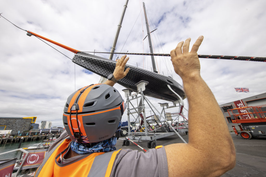 America's Cup sailor assisting with the launch of an America's Cup 75 monohull in Auckland
