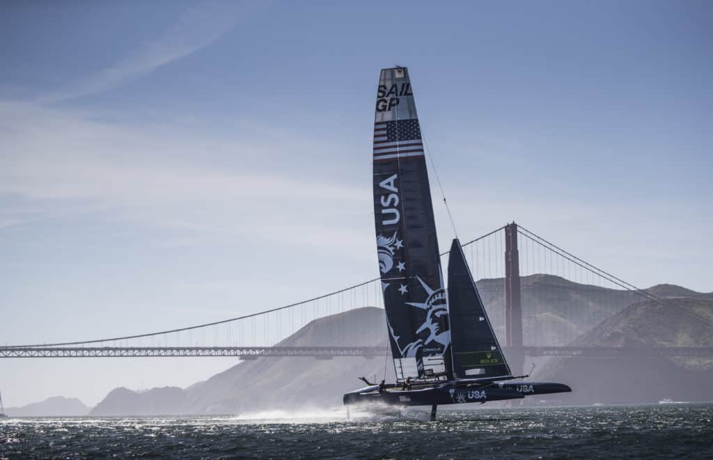 A foiling catamaran on San Francisco Bay with Golden Gate Bridge in Background