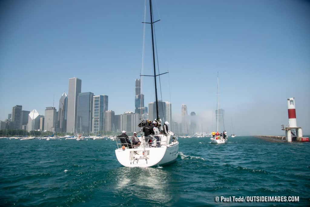 Racers return to shore as fog breaks over the Chicago cityfront