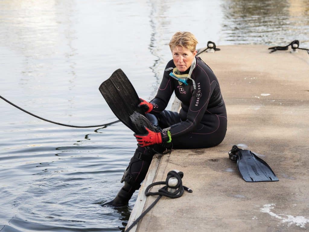 Marlene Plumley prepping to clean one-design boats