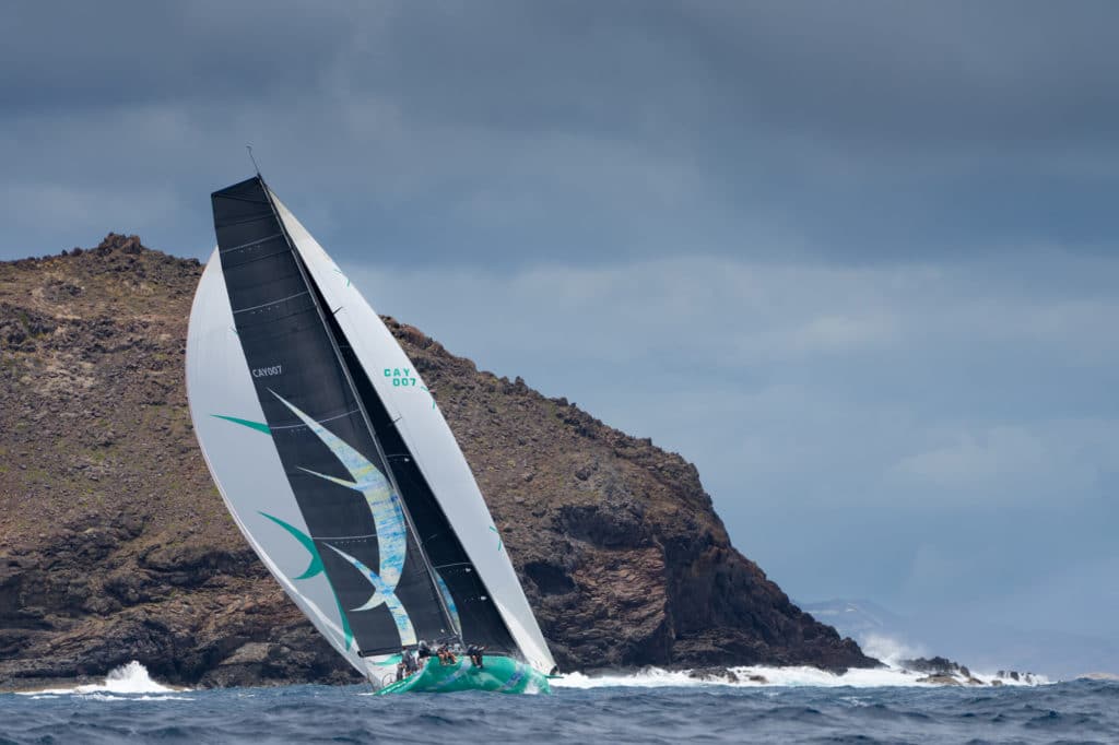 Maxi72 Vesper sailing along the rocky shoreline in St. Barts