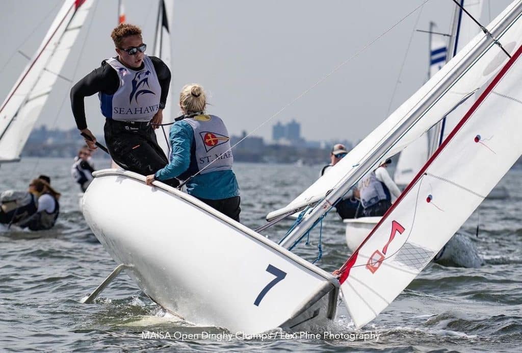 college sailors tacking a dinghy