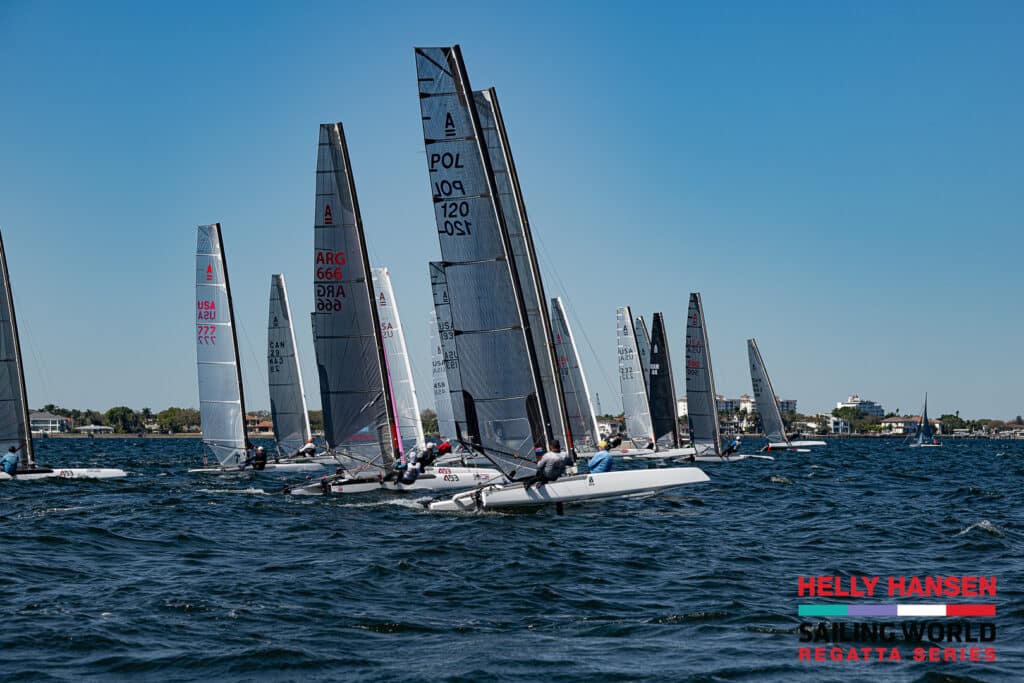 catamarans racing in st. petersburg with crew hanging on trapeze wires off the sides of the high-performance cats
