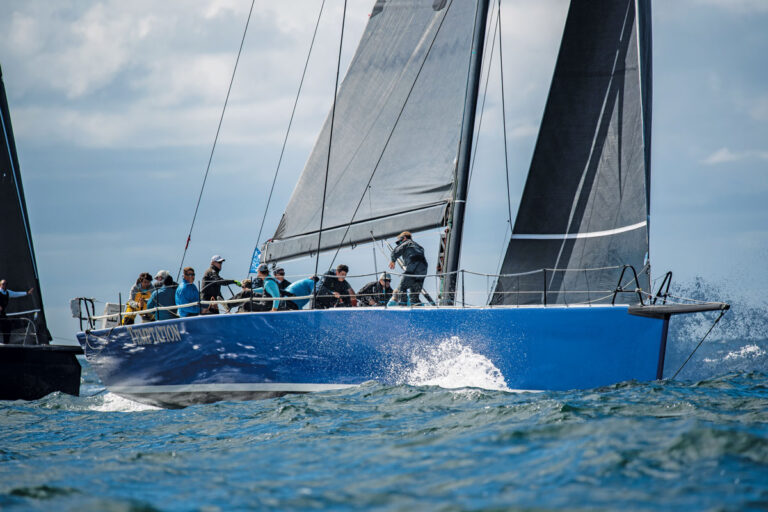 high-tech raceboat with active crew sailing through splashing water at the ORC World Championships in Newport Rhode Island