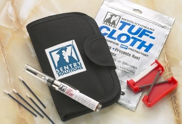 Sentry Solutions' Knife & Tool Care Kit includes (from left) cleaning tools,  a bottle of Tuf-Glide lubricant, a carrying case, Tuf-Cloth lubricating wipes, and a Gatco sharpener.