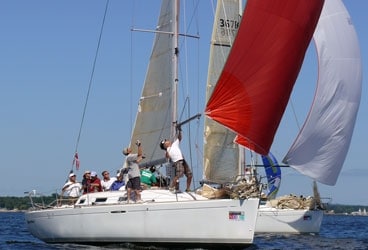 The crew of Richard Palmer's Beneteau 36.7 Breakaway starts down what turns out to be a long, shifty run, full of no-wind holes.