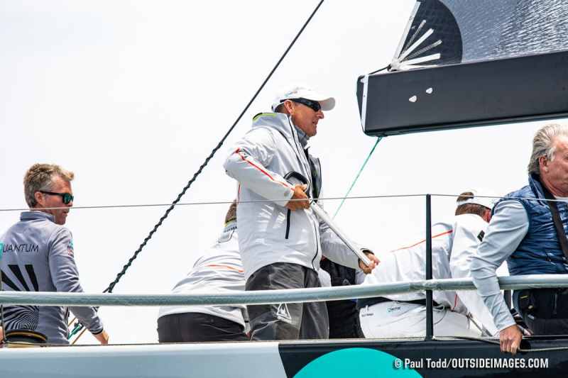 Doug Devos, on the helm, rounds the weather mark on his TP52 Windquest.