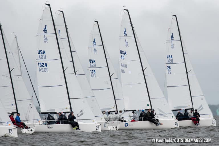 Fleet of white sailboats