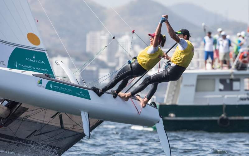 Cousins Jason Waterhouse and Lisa Darmanin carried the yellow leaders jersey over the last two days of fleet racing in the Nacra 17 class and never let it go, crossing the finishing line of the Medal Race in fifth place and thus securing overall first after a consistent week.
“This has been a really tricky week and we are super stoked,” said Waterhouse. “I’m so proud of my cousin Lisa and we’ve been working to do this together for about eight years now and there’s one more goal in mind and that’s where we are heading. This is just an awesome way to end it with one year to go.”