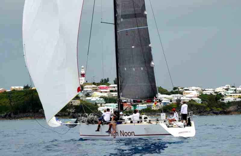 2016 Newport Bermuda Yacht Race finish. HIGH NOON, a Tripp 41 skippered by Peter Becker and crewed by 7 young sailors aged between 15 and 18. sneaks over the St David’s Lighthouse finish line to take elapsed time honours within the traditional fleet. newport bermuda race
