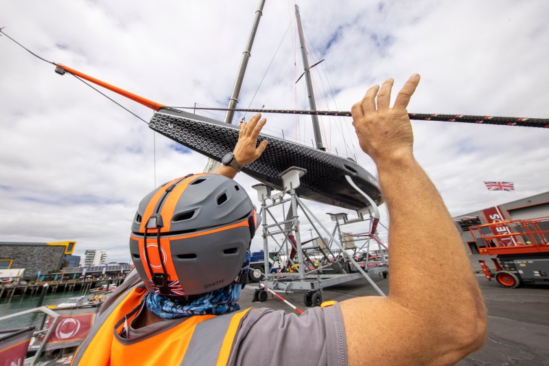 America's Cup sailor assisting with the launch of an America's Cup 75 monohull in Auckland