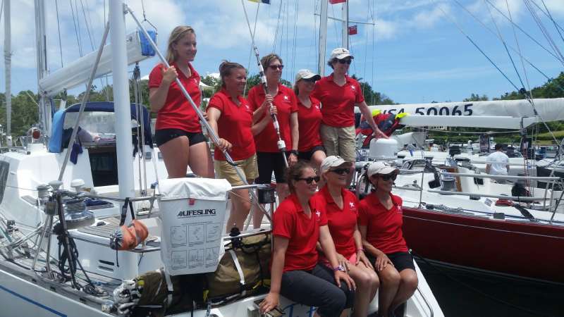 The crew of Etoile poses upon arrival to Hamilton, Bermuda, while awaiting Customs clearance.