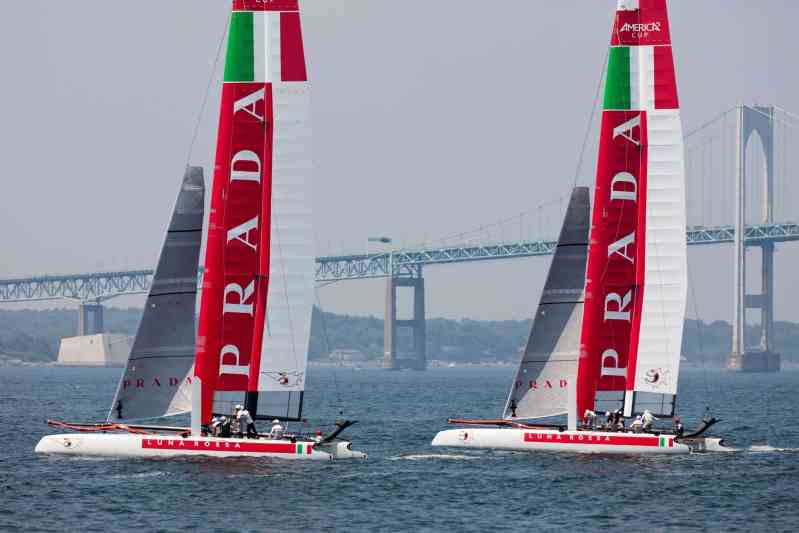 Luna Rossa Swordfish and Piranha sail in front of the Newport-Jamestown Bridge.