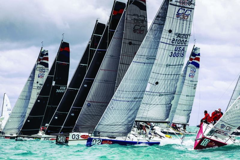 In order to find a whole at a crowded start – like Key West Race Week – try to break any windward overlaps as you make your port-tack approach.