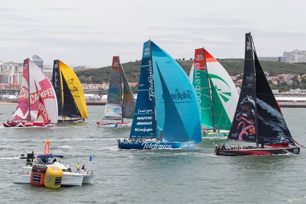 The fleet of Volvo Open 70's power away for the start of the Oeiras In-Port Race in Lisbon, during the Volvo Ocean Race 2011-12. (Credit: IAN ROMAN/Volvo Ocean Race)