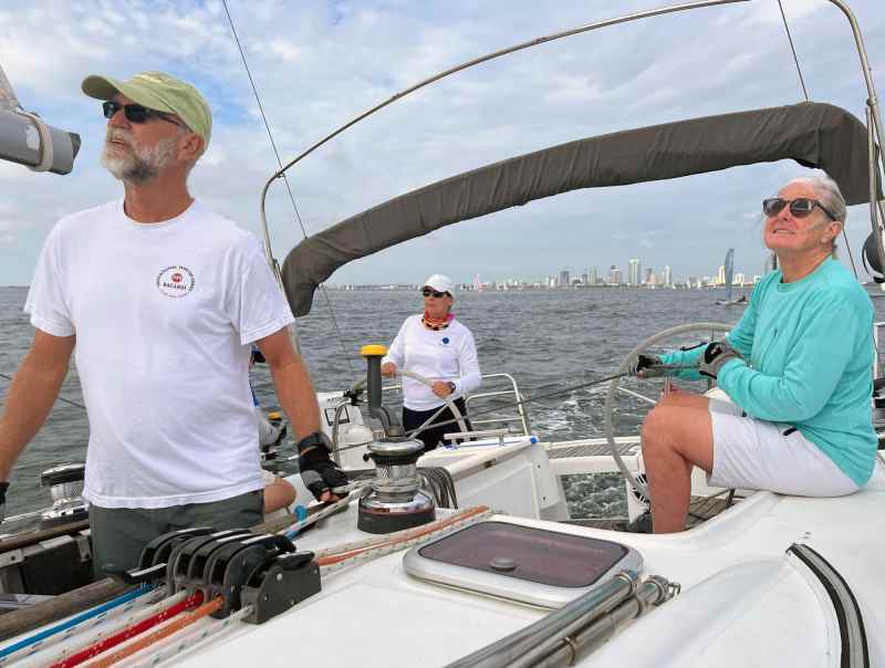 Liquid-Sunshine Ed (left) and Pemmy (right) Roarke work the Beneteau 40 down the course of the North Sails Rally Race at the Helly Hansen Sailing World Regatta Series on St. Petersburg en route to a win in the Racer/Cruiser division.