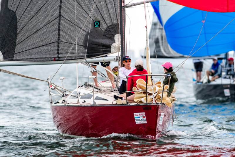 220219__NAUTICAL_IMAGES_540_TODD A Hobie 33 foredeck team awaits its next maneuver at the Helly Hansen Sailing World Regatta St. Petersburg. The Hobie 33, designed in 1982 remains active in many locations around the US today.