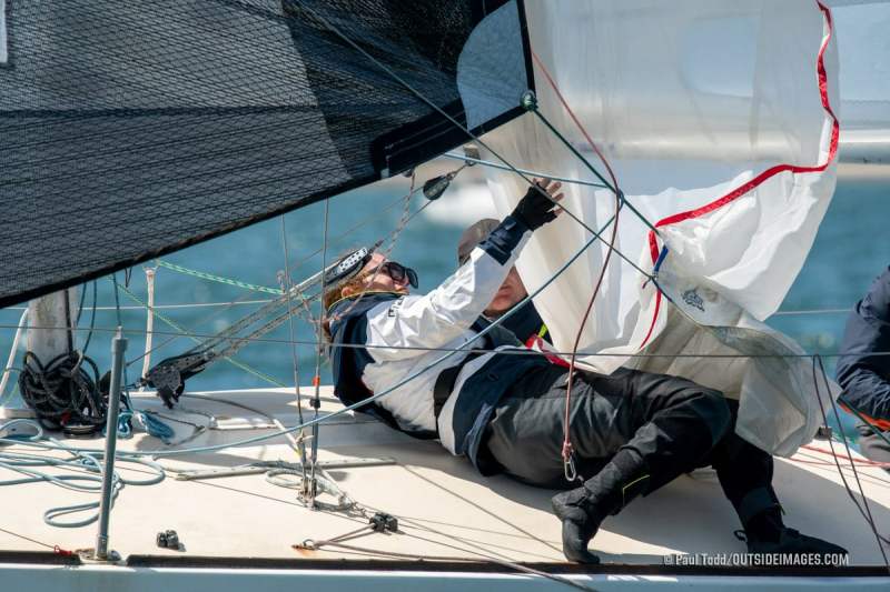 220327__NAUTICAL_IMAGES_335_TODD A J/24 crew douses a spinnaker at the Helly Hansen Sailing World Regatta in San Diego.