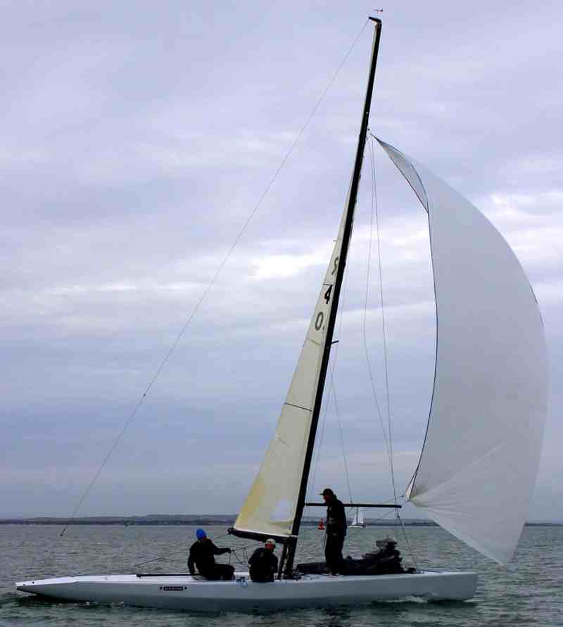 Sailboat sailing downwind with mast leaning forward over the deck