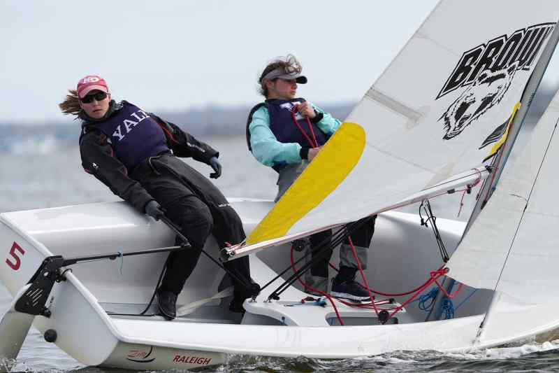 Bsail042422-2885 college sailors in a dinghy at Brown University