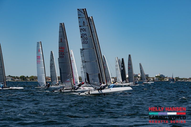 catamarans racing in st. petersburg with crew hanging on trapeze wires off the sides of the high-performance cats