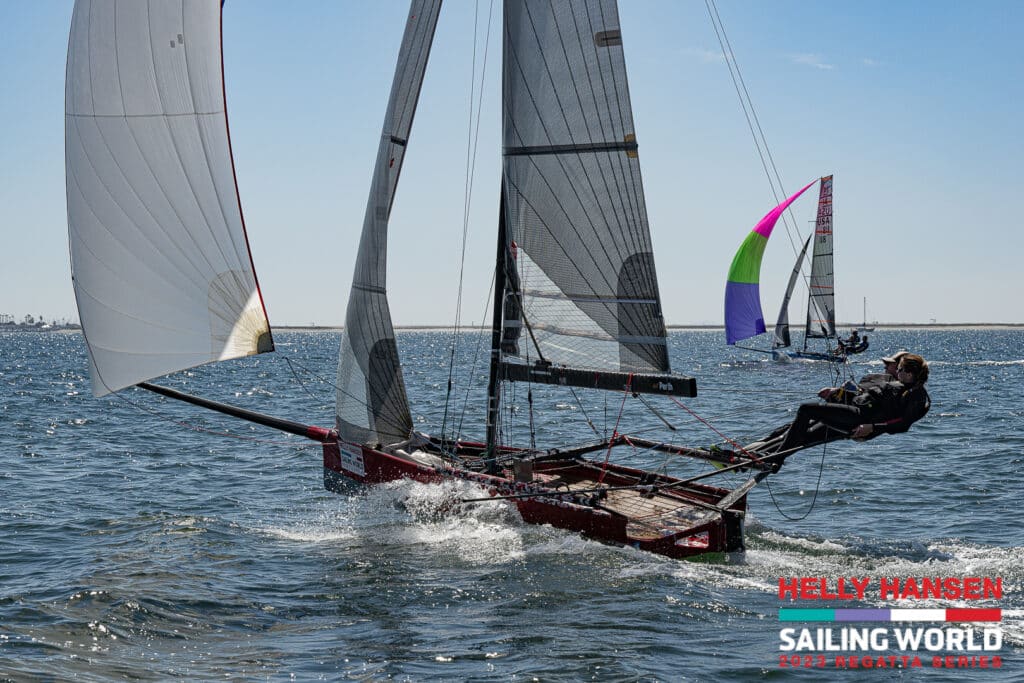 two-person sailboat with crew on trapeze wire