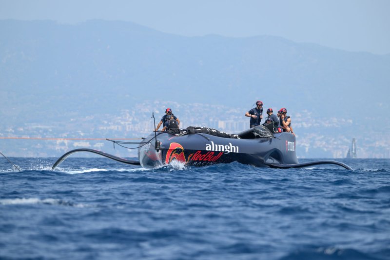 37AC_240820_RP1_0553 Alinghi Red Bull Racing's sailing team returns to base with a section of its broken spar on board Boat One.