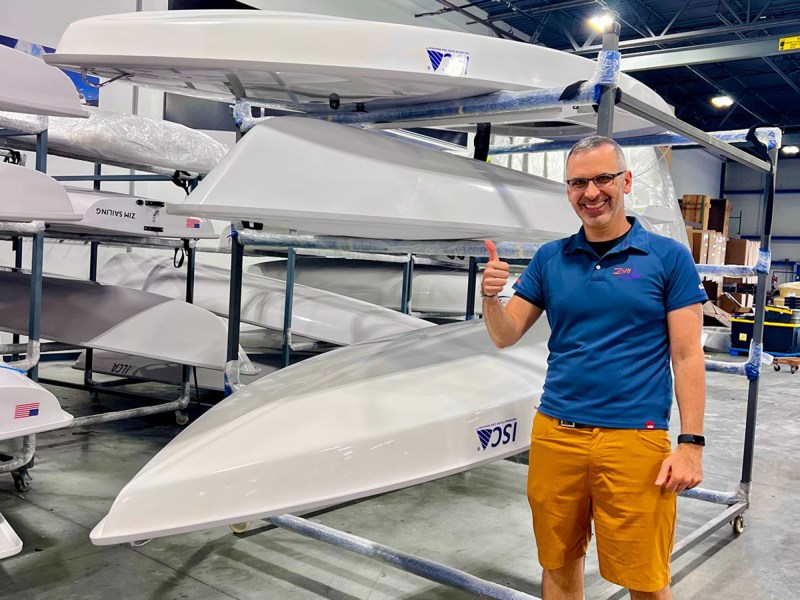 Starting Line Sailing CEO George Yioulos alongside new Zim-built ILCA and ISCA dinghies ready to be shipped to customers in early July.