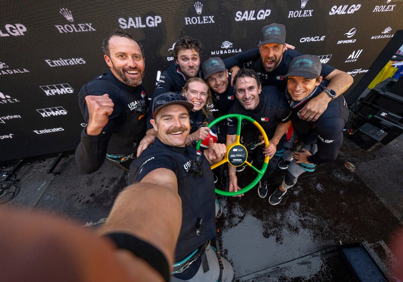 KPMG Australia Sail Grand Prix | SydneyEvent 3 2026 Season (L-R) Peter Kinney, grinder of United States SailGP Team, Taylor Canfield, driver of United States SailGP Team, Hans Henken, flight controller of United States SailGP Team, Anna Barth, strategist of Germany SailGP Team presented by Deutsche Bank, Harry Melges IV, reserve sailor of United States SailGP Team, Michael Menninger, wing trimmer of United States SailGP Team, Andrew Campbell, strategist of United States SailGP Team, and Mac Agnese, grinder of United States SailGP Team, celebrate on the podium with the winners wheel following victory in the final race of the event on Race Day 2 of the KPMG Australia Sail Grand Prix in Sydney, Australia.