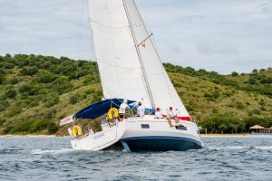 Team Never Alone sails into Virgin Gorda Sound for another leg win during the 2025 edition of the BVI Championship. The team returns to defend in November.